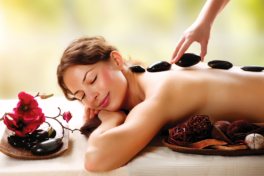 woman relaxing - stone massage therapy